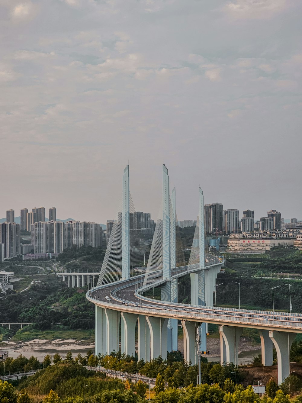 a view of a bridge with a city in the background
