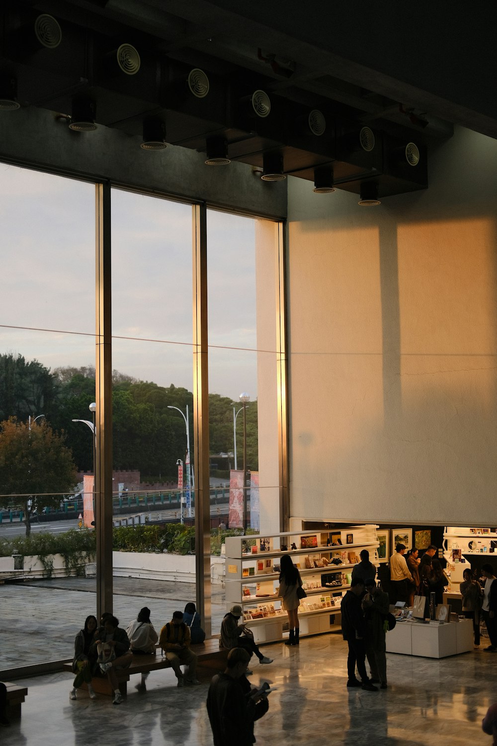 a group of people standing in front of a window