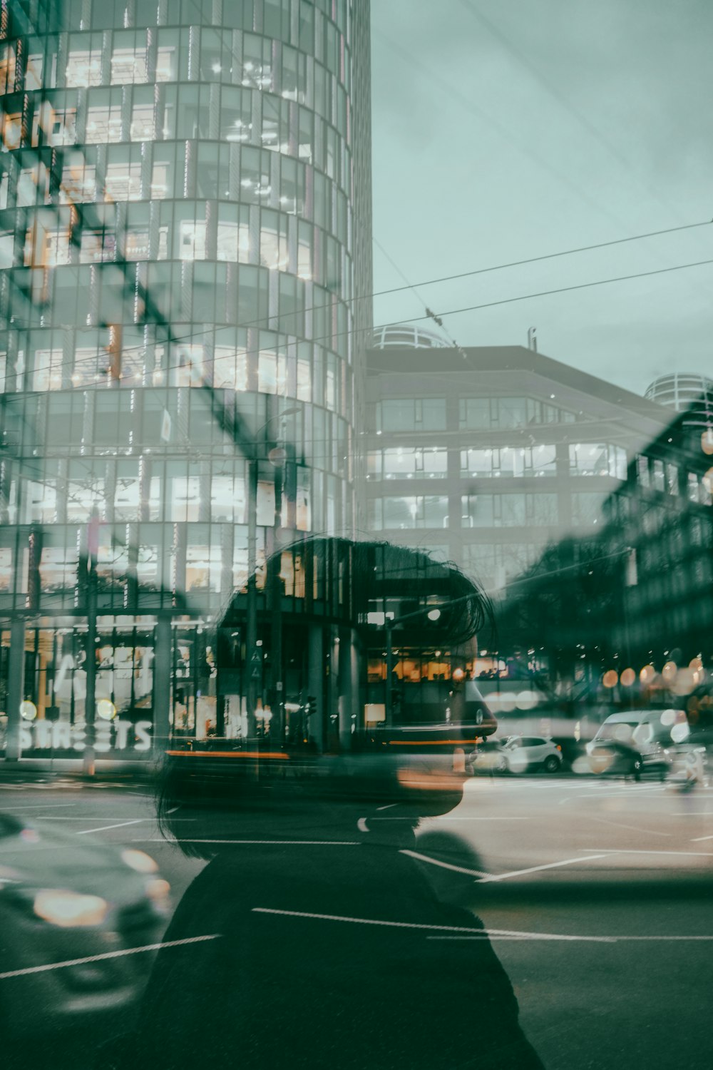 a blurry photo of a city street with a building in the background