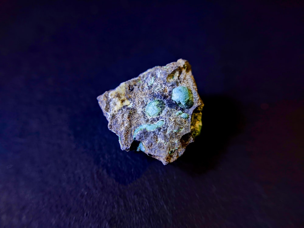 a piece of rock sitting on top of a table