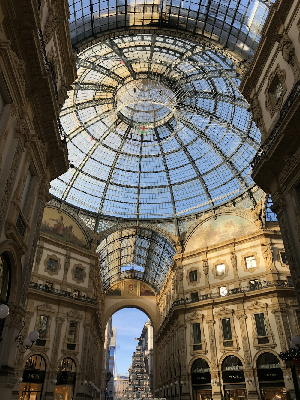 a large building with a glass ceiling and a clock