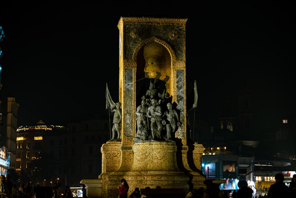 a clock tower with a statue on top of it