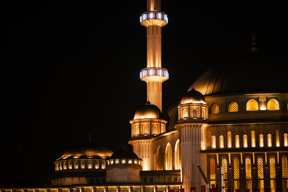 a large building lit up with lights at night