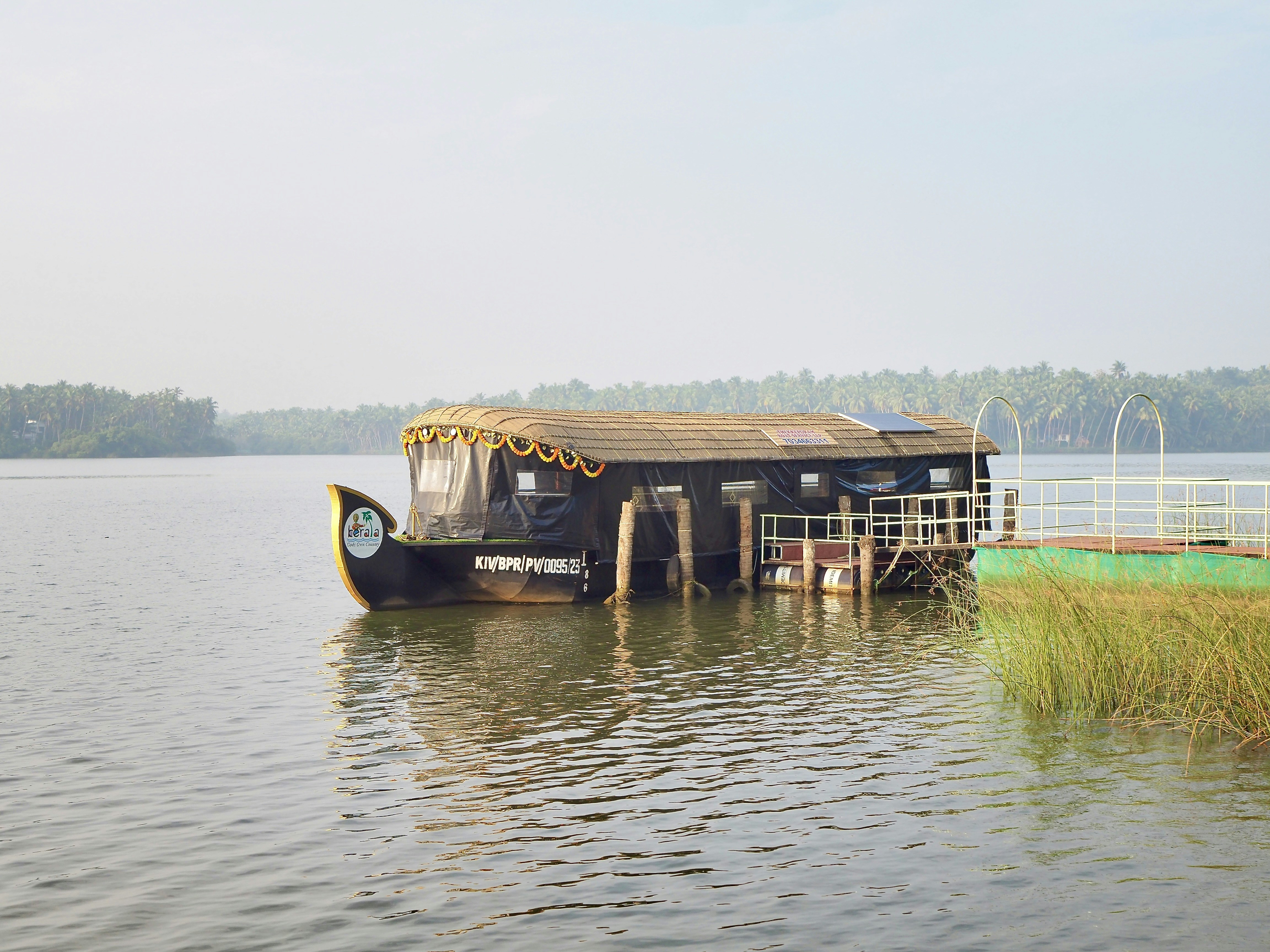 a boat is docked at a dock on a lake