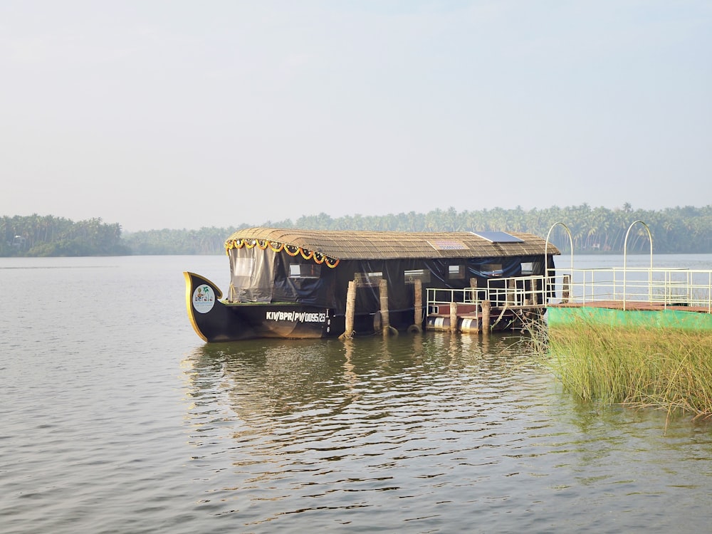 a boat is docked at a dock on a lake