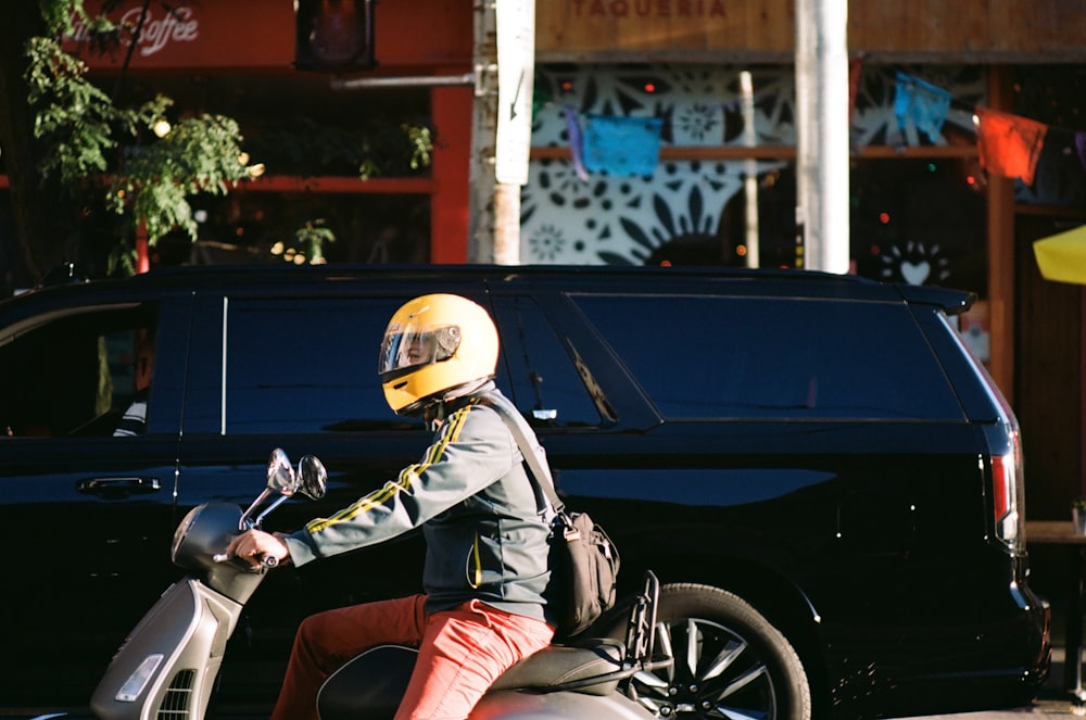 a person riding a motorcycle on a city street