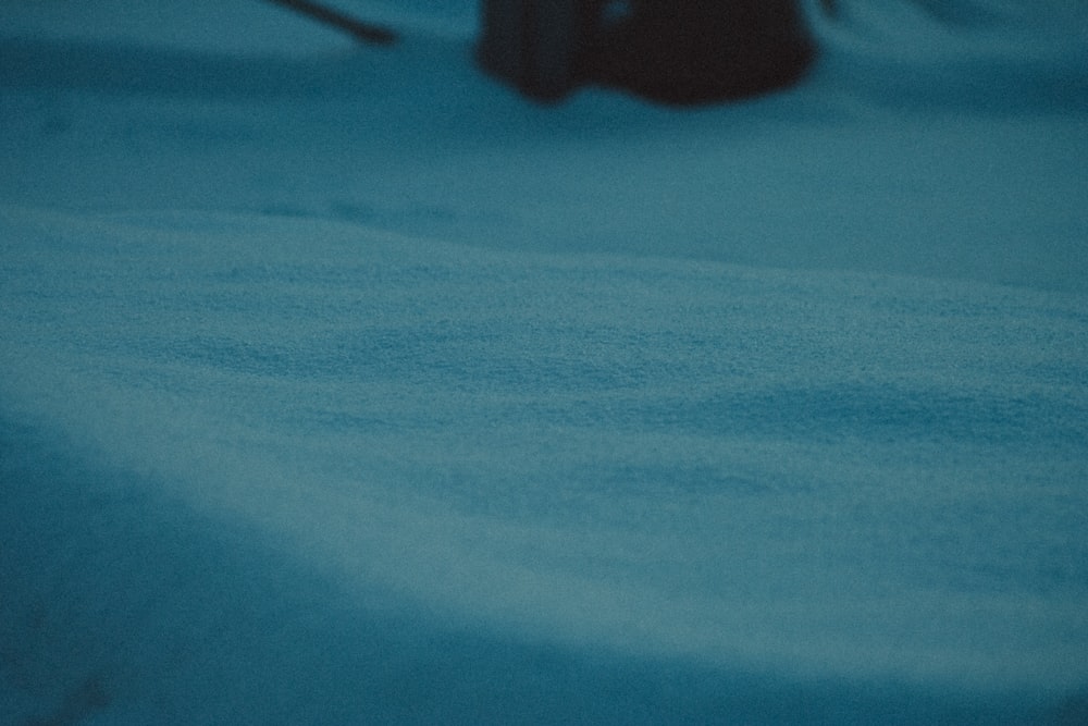 a blurry photo of a person walking in the snow