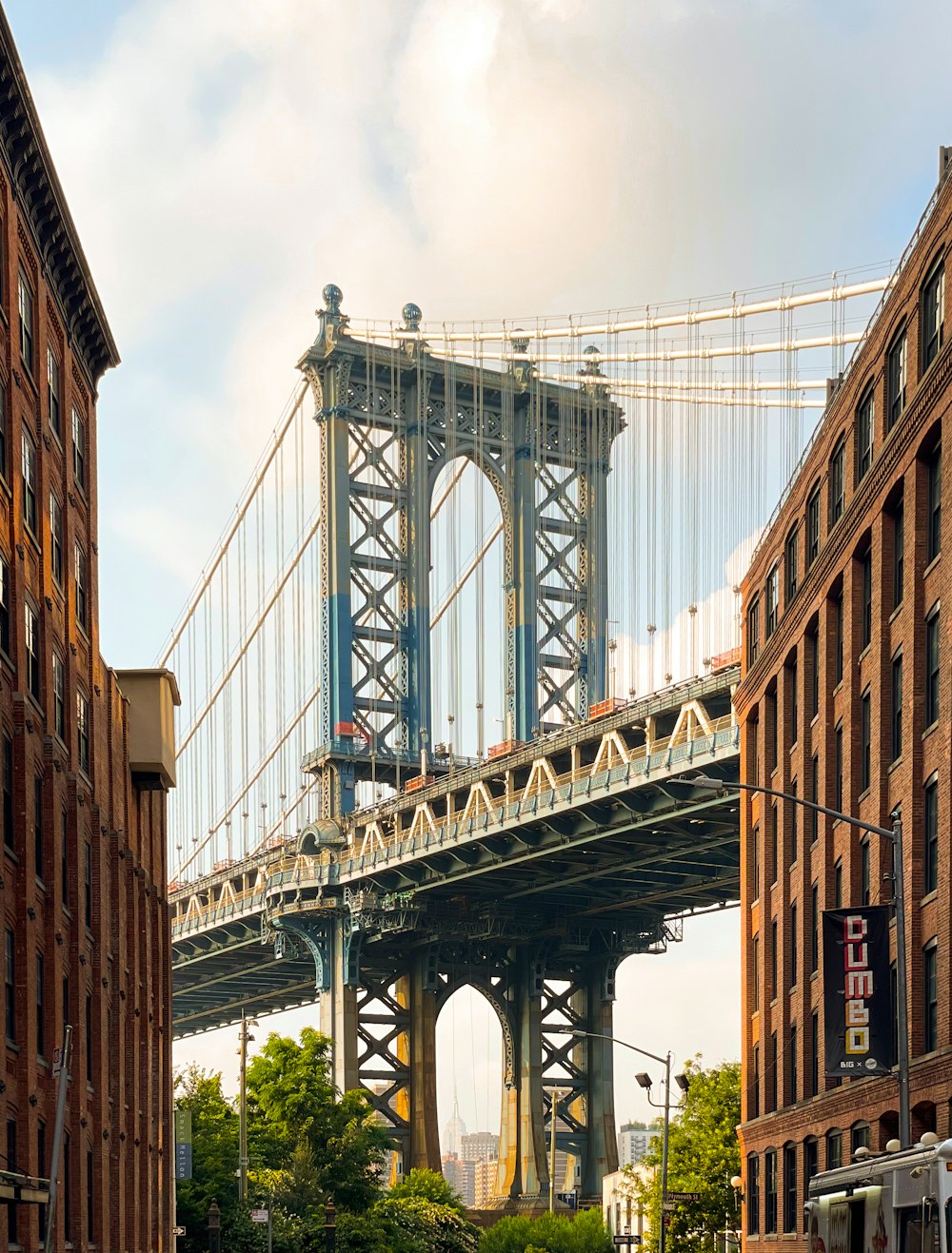 a large bridge spanning over a city with tall buildings