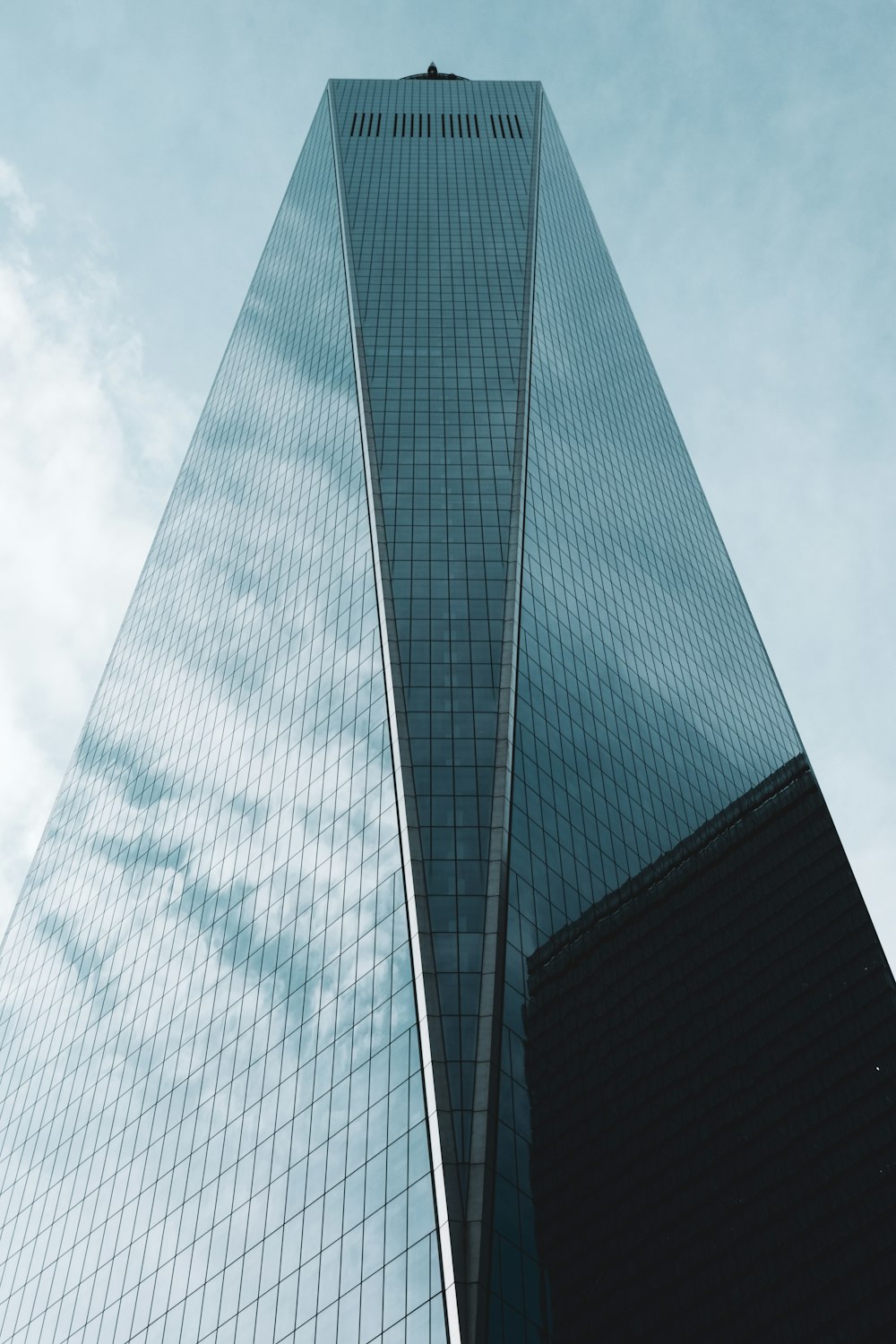 a very tall building with a sky background