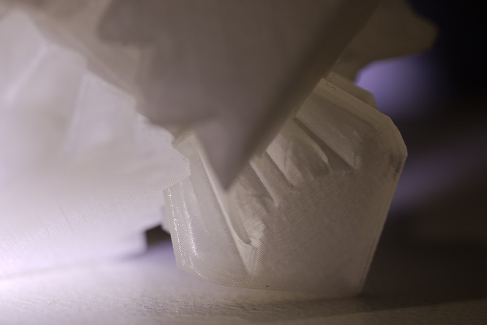 a close up of a white object on a table