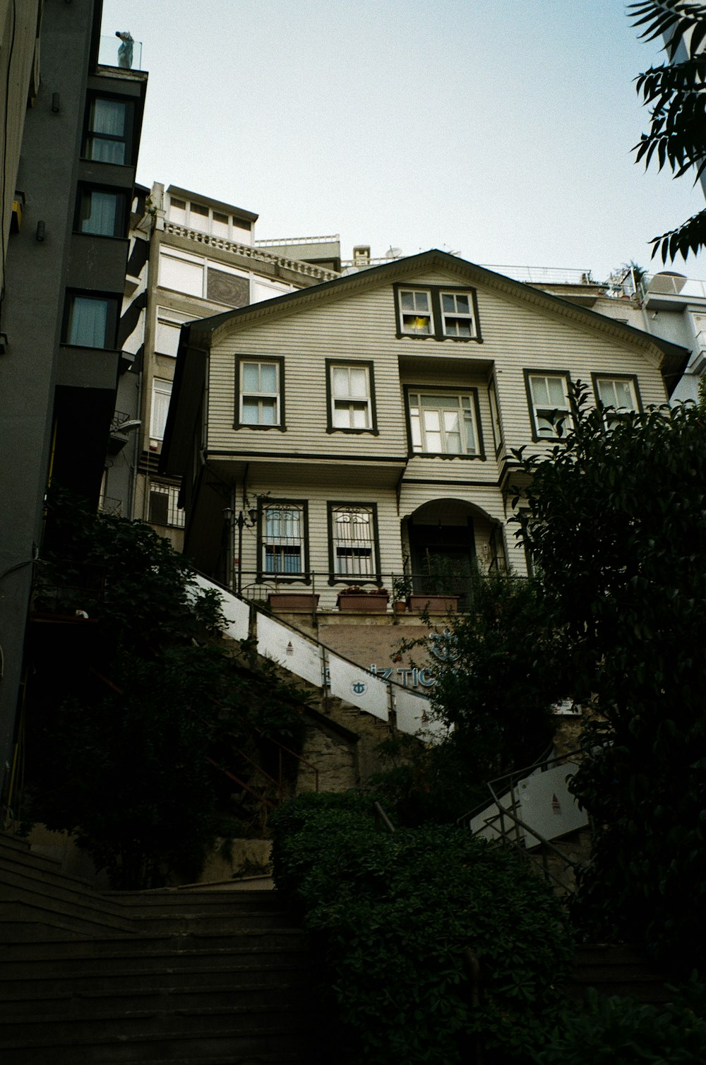 a house with a staircase going up the side of it