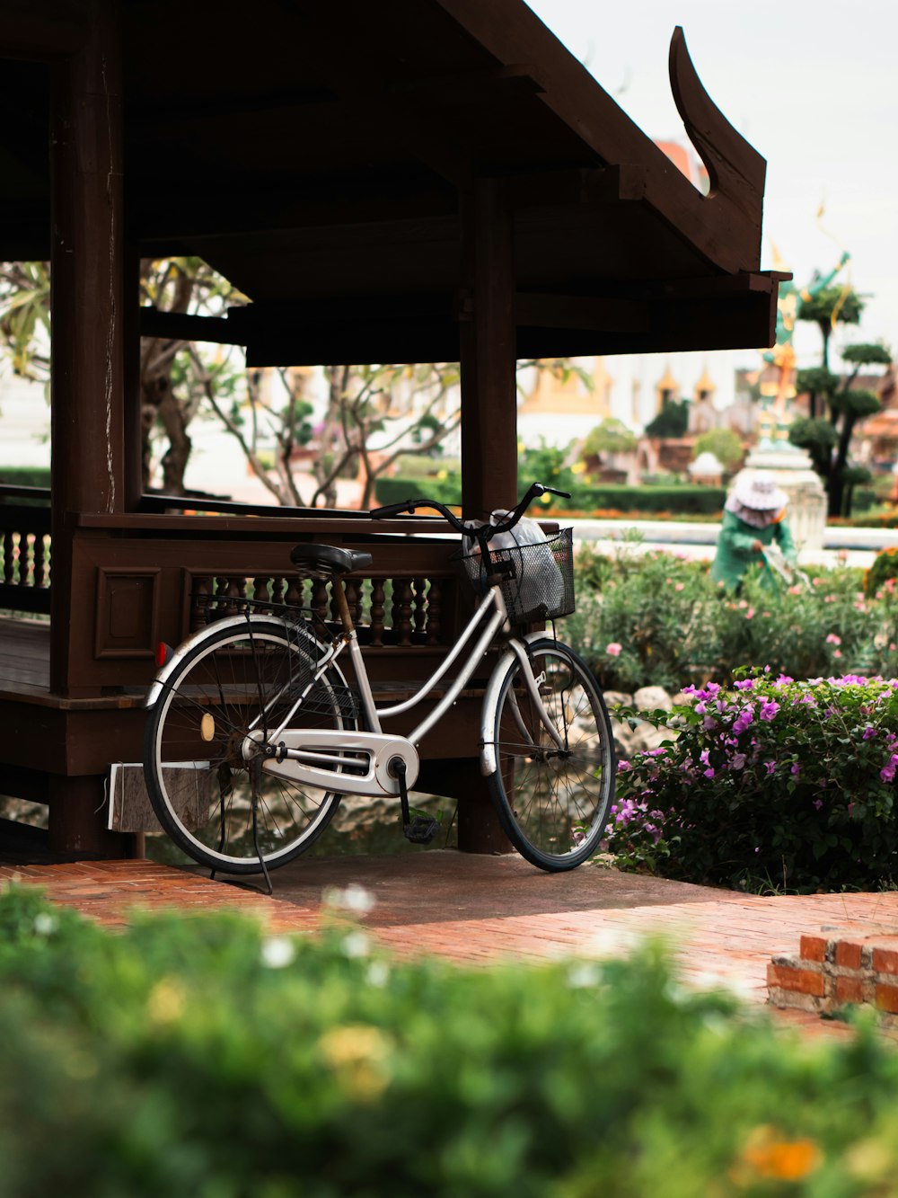 a bicycle is parked in front of a gazebo