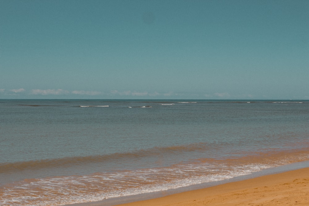 a person riding a surf board on a beach