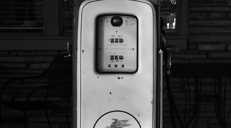 a black and white photo of a gas pump