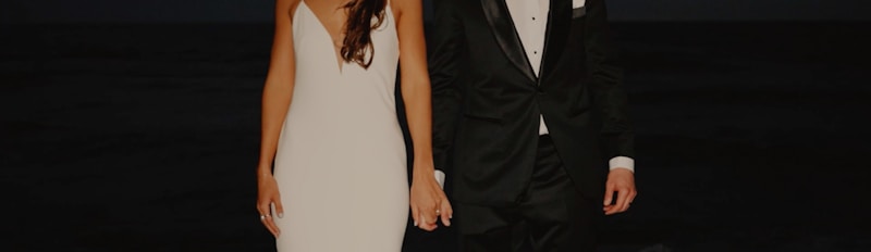 Elegant tuxedo couple pose