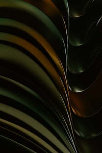 a close up of a black and gold abstract background