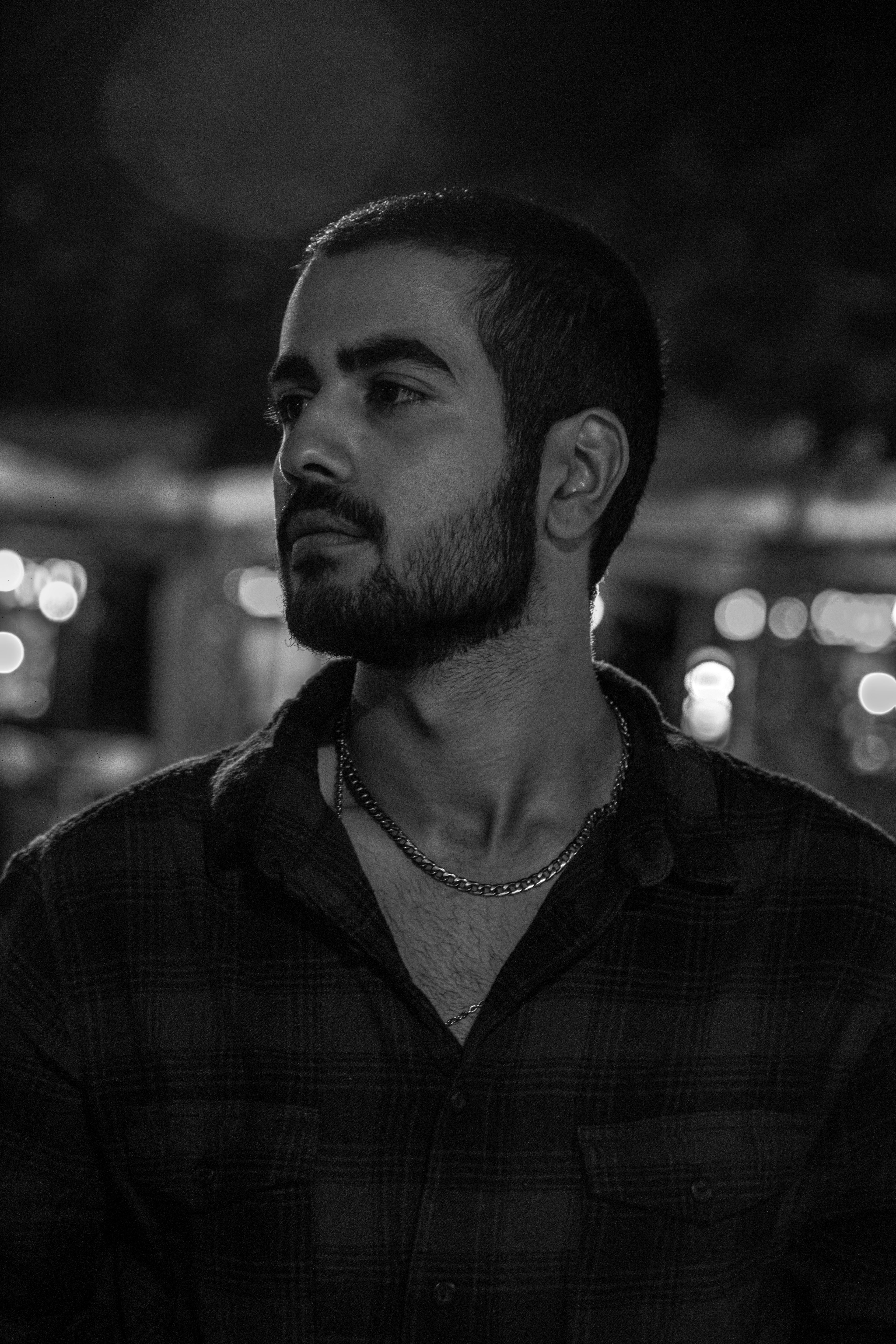 Barber refining a buzz cut with multiple guard lengths