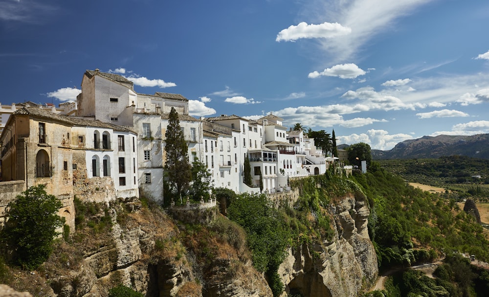 a group of buildings on the side of a cliff