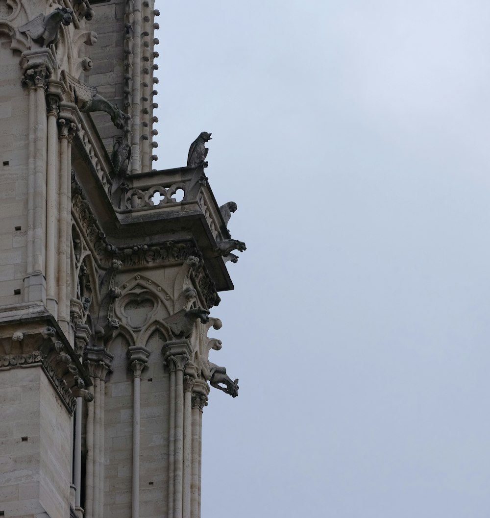 a clock on the side of a tall building