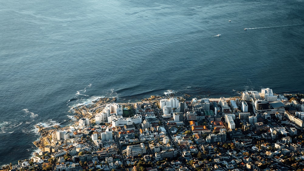 an aerial view of a city by the ocean