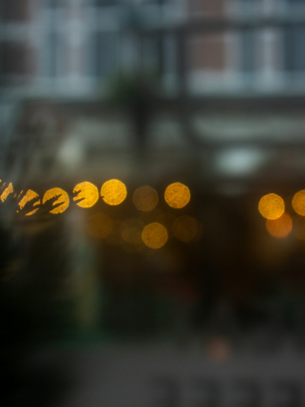 a blurry photo of a street sign with a building in the background