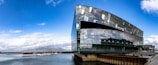 a large building sitting next to a body of water
