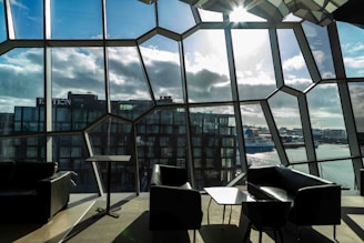the sun shines through the windows of a modern building