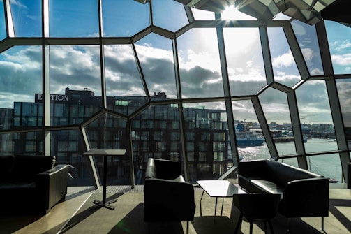 the sun shines through the windows of a modern building