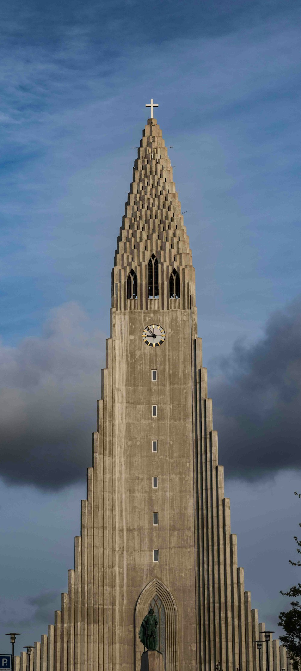 a very tall building with a clock on it's side