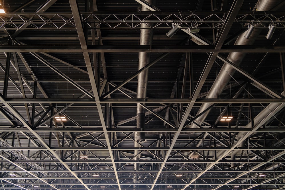 a group of people standing under a metal structure