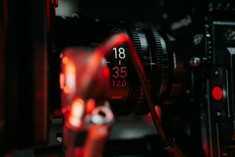 a close up of a camera with a red light