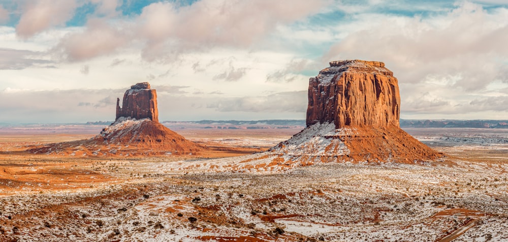 a large rock formation in the middle of a desert