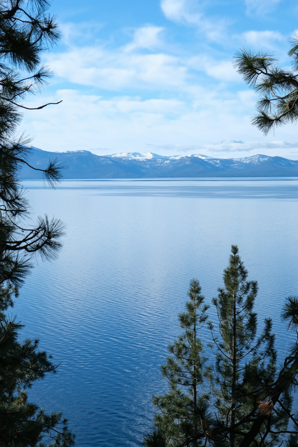 a view of a body of water with mountains in the background