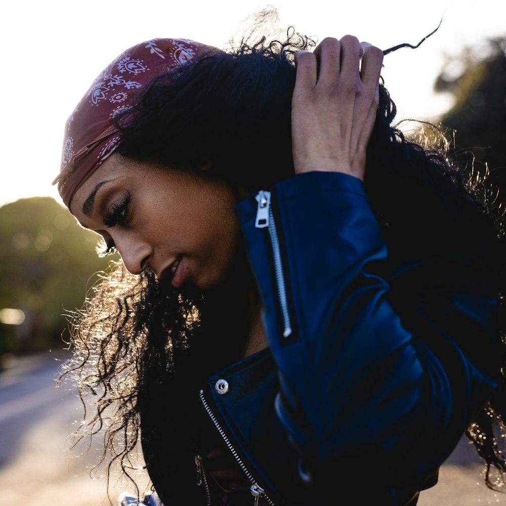 a woman with a bandana on her head