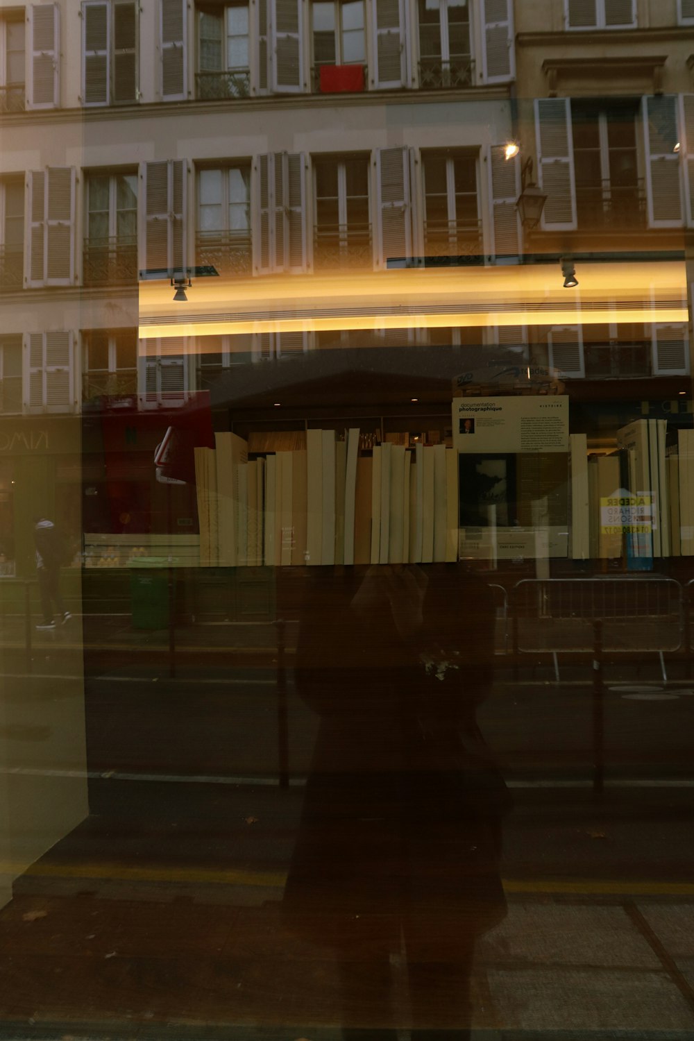 a reflection of a building in a window