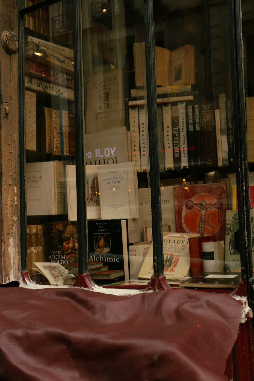 a window that has a bunch of books in it
