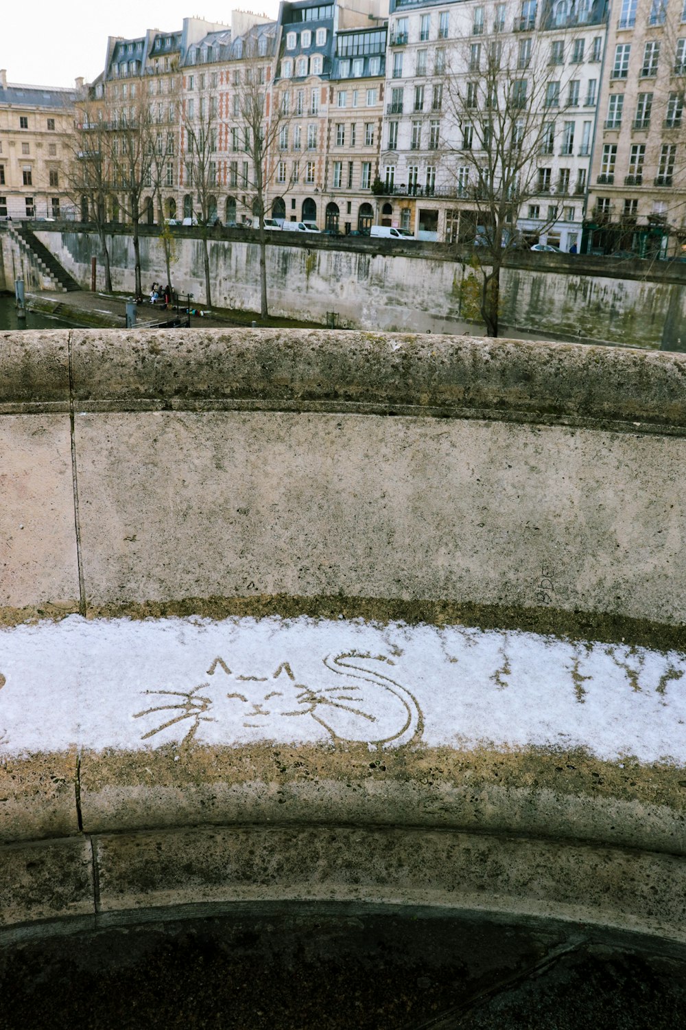 a bench with a drawing of a cat on it