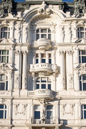 a large white building with many windows and balconies