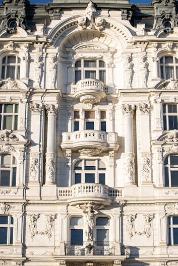 a large white building with many windows and balconies
