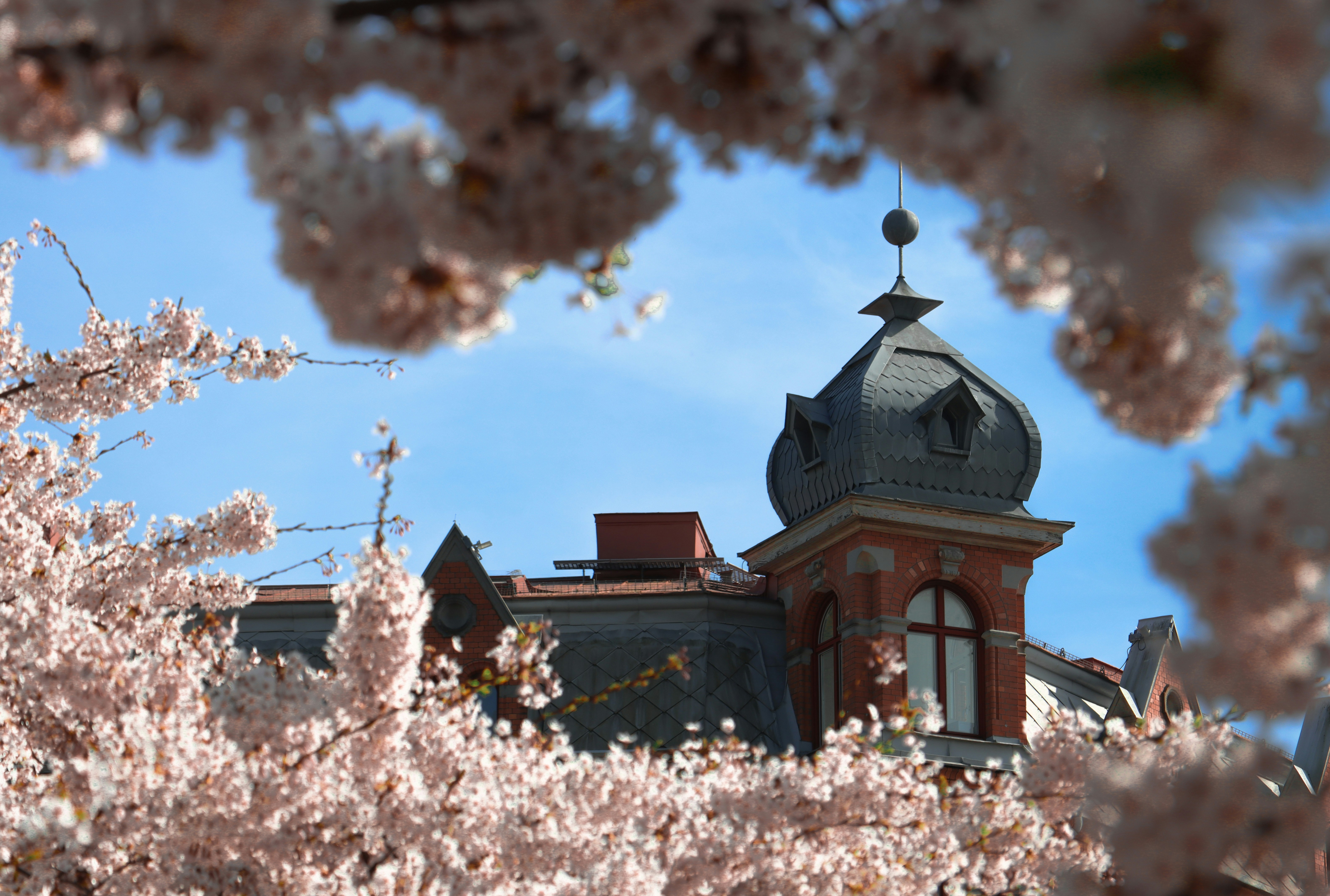 a large building with a tower and a clock on top of it