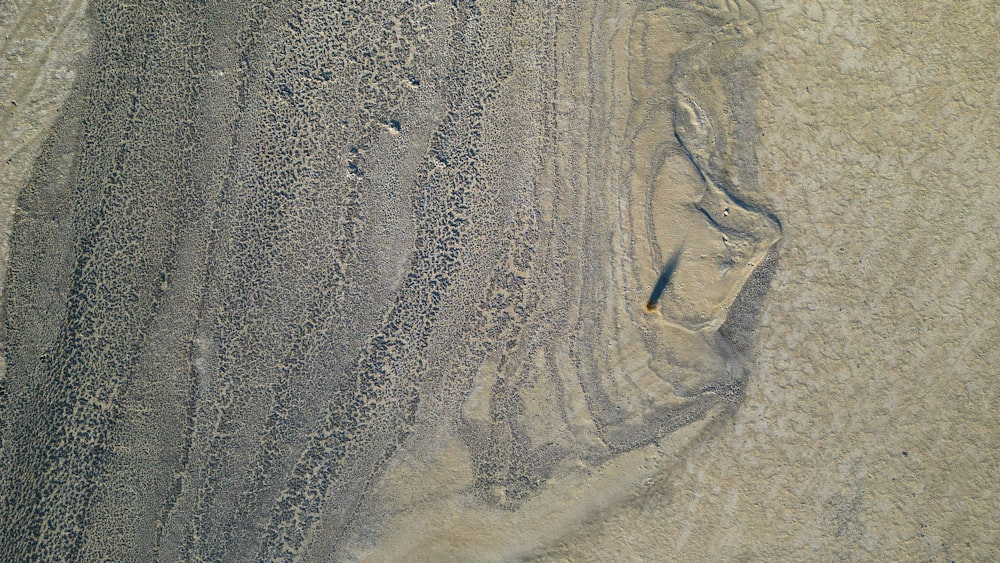 an aerial view of a sandy beach area