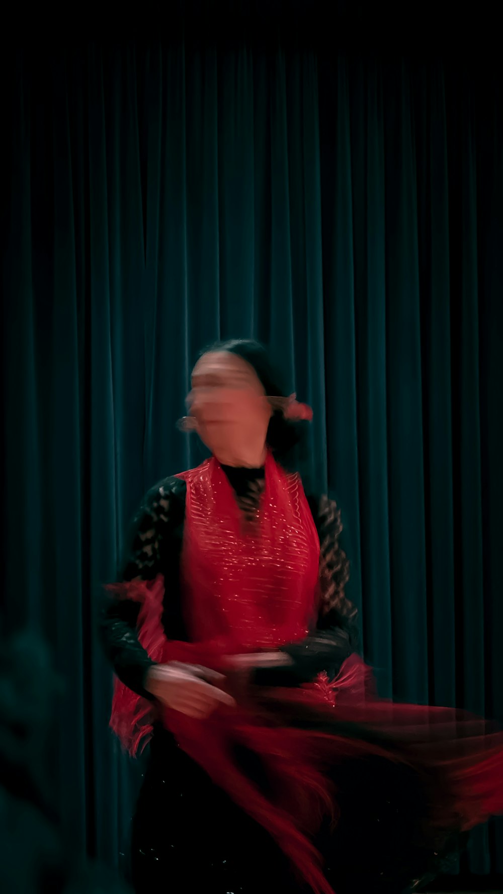 a woman in a red dress is dancing