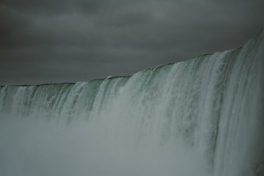 a large waterfall with water pouring out of it