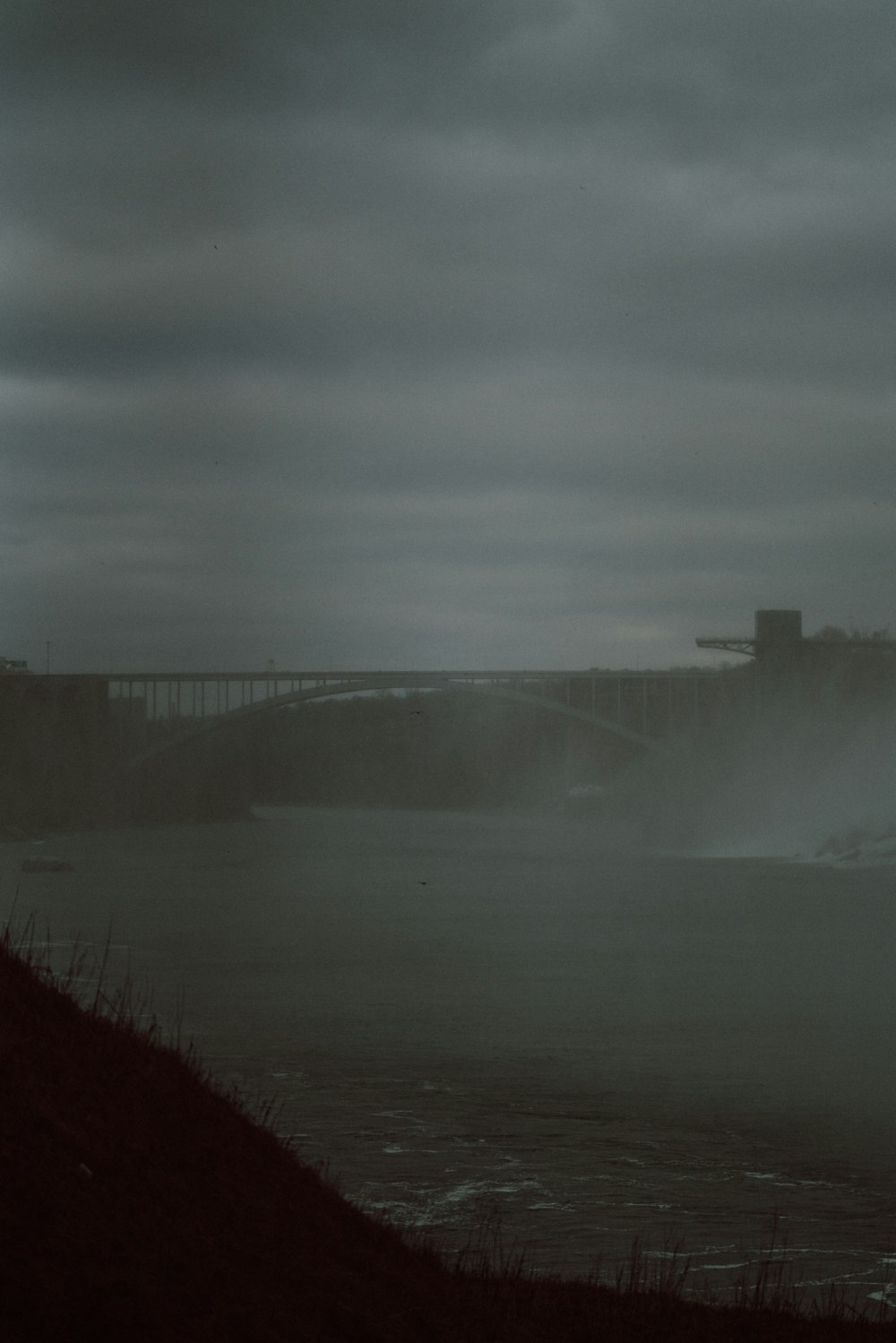 a foggy view of a large body of water