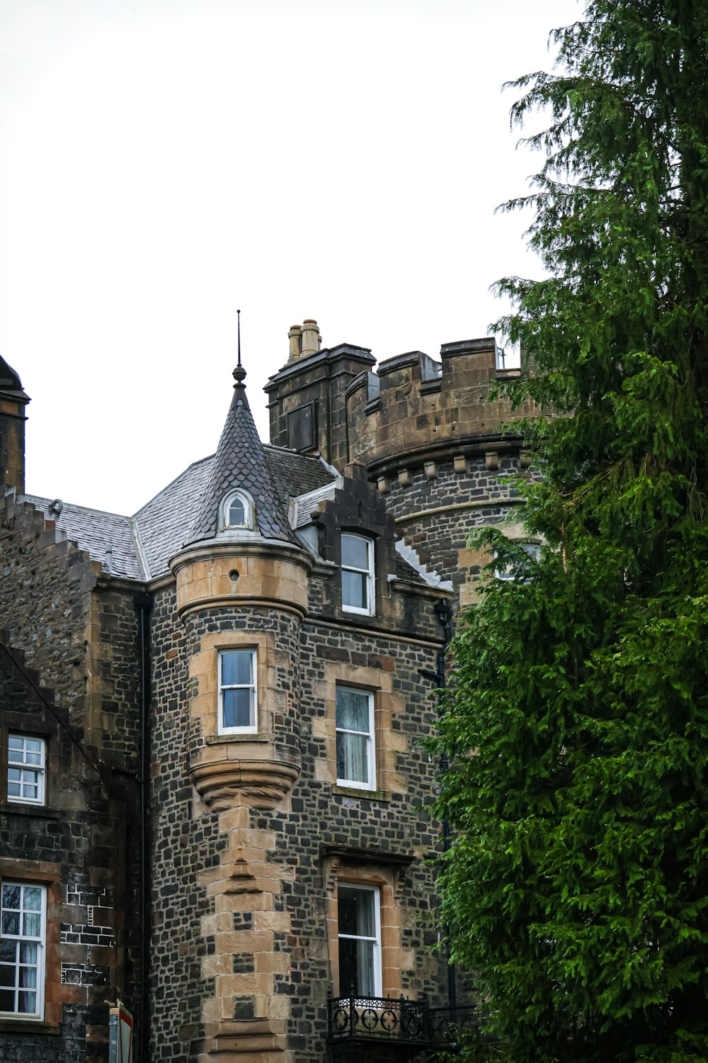 a large stone building with a clock on the top of it