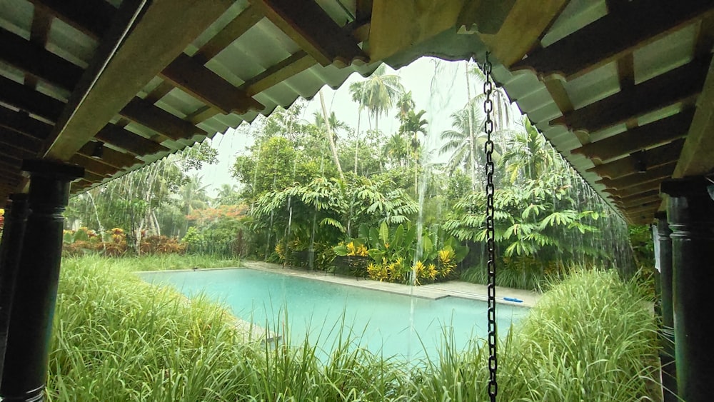 a view of a pool from inside a house