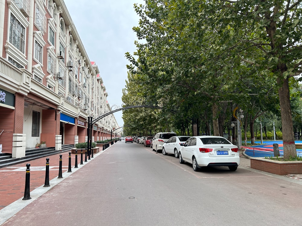 a row of cars parked on the side of a street