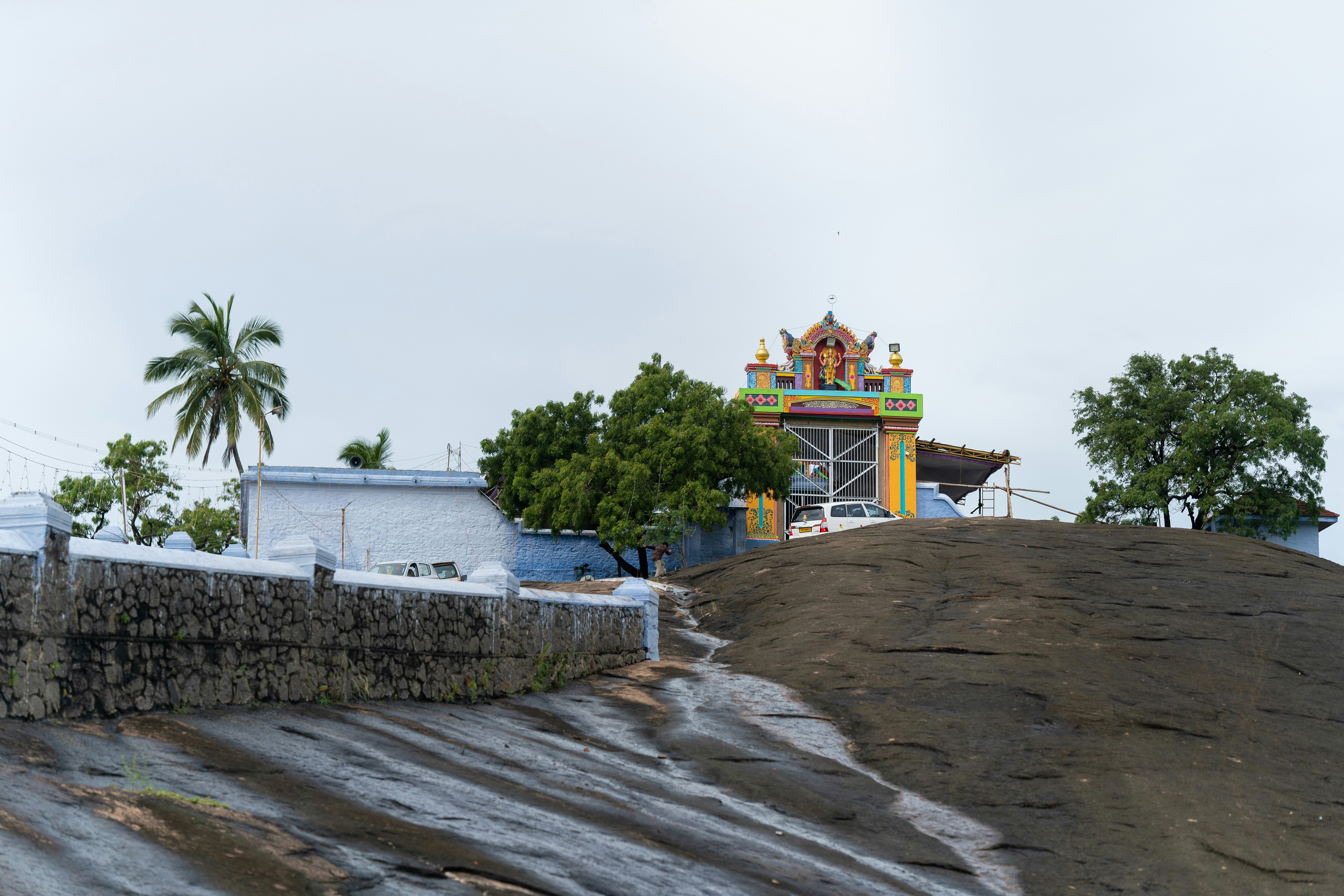 a large mound of dirt next to a building