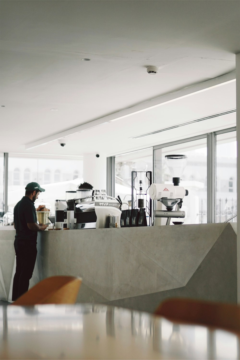 a man standing at a counter in a restaurant