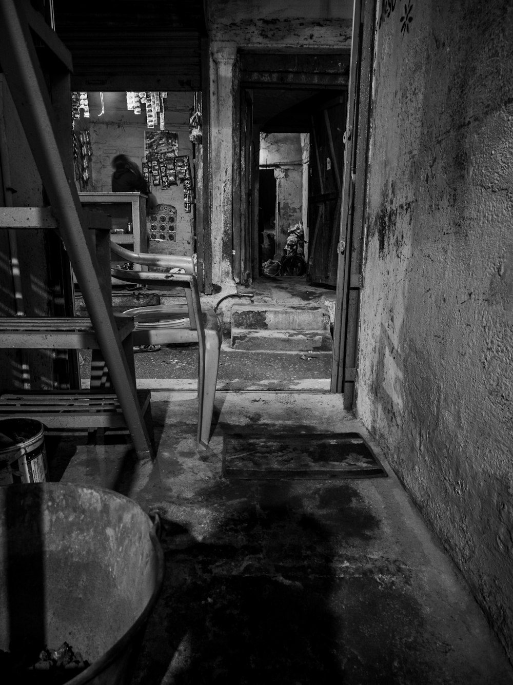 a black and white photo of a dirty room